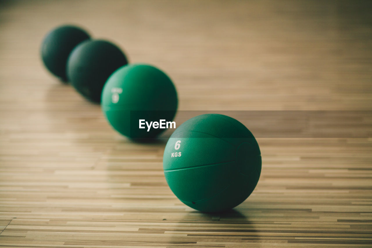 Close-up of ball on hardwood floor