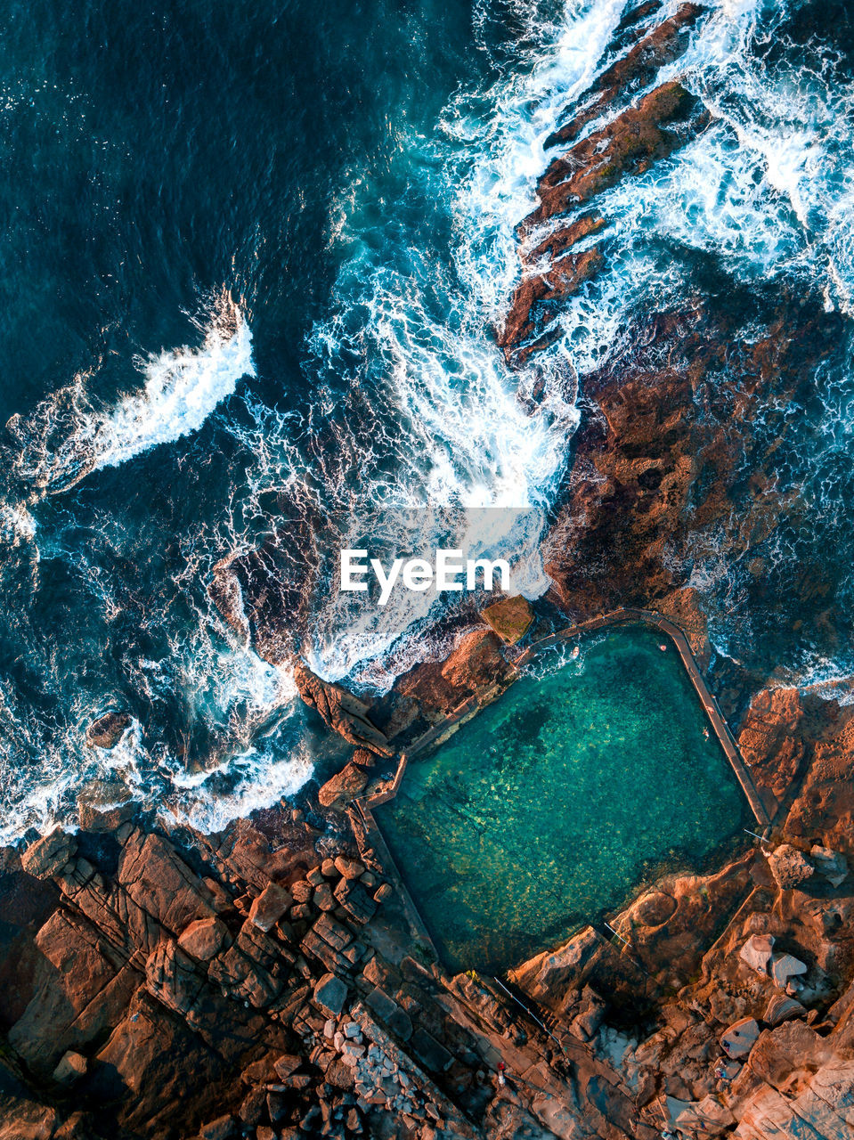 High angle view of rock formation in sea