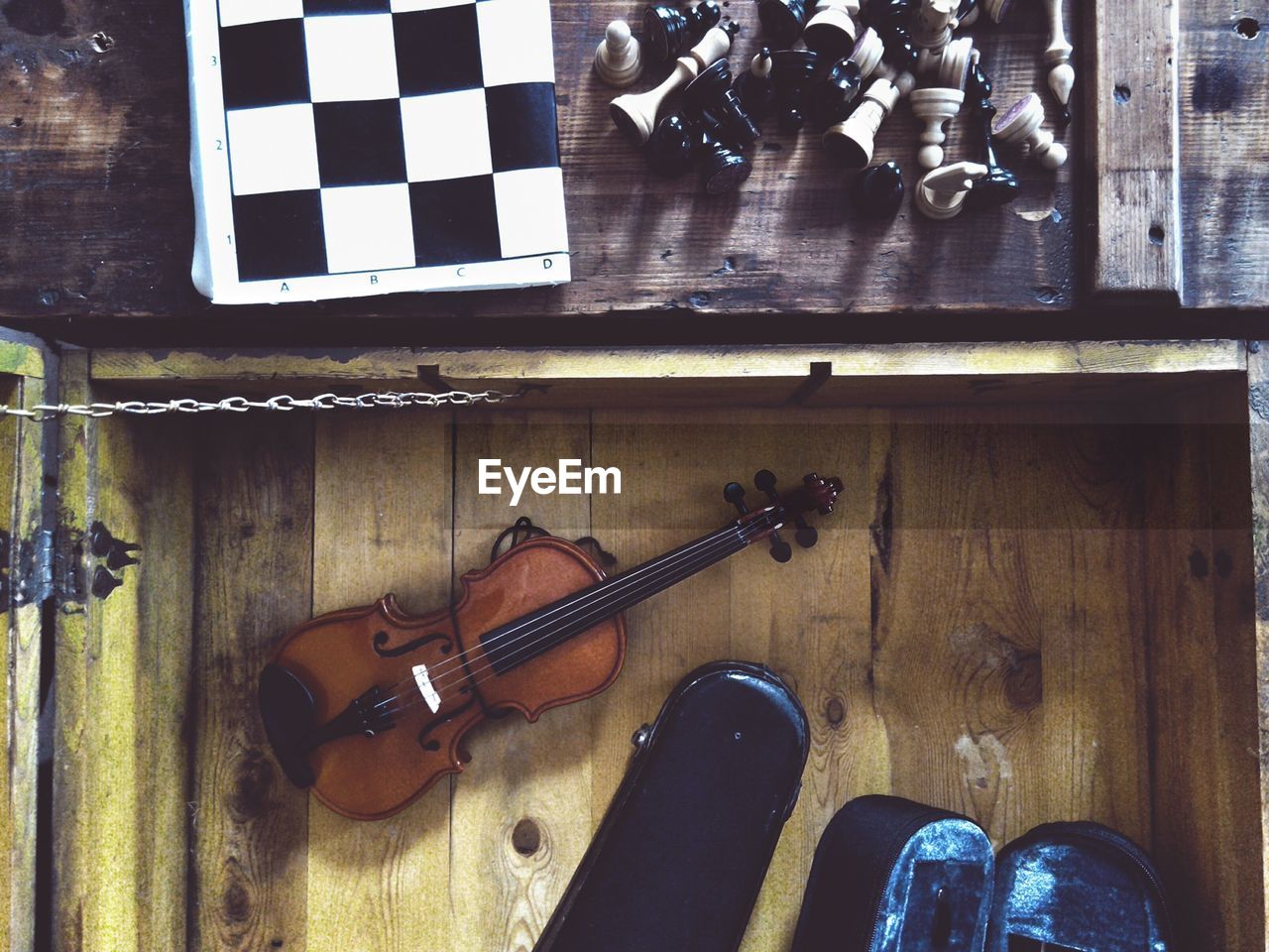 HIGH ANGLE VIEW OF PIANO AND TABLE ON STAGE