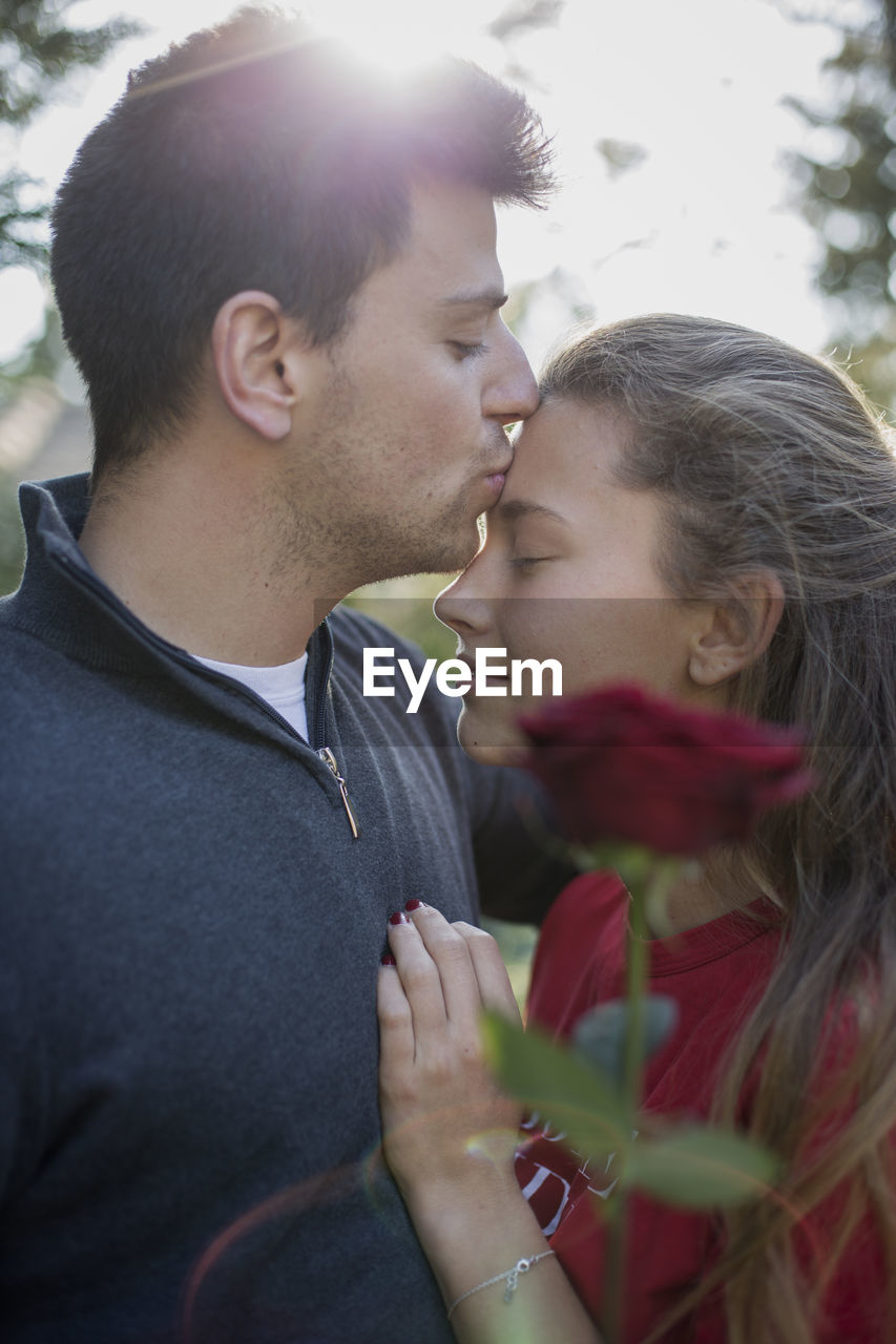 YOUNG COUPLE KISSING