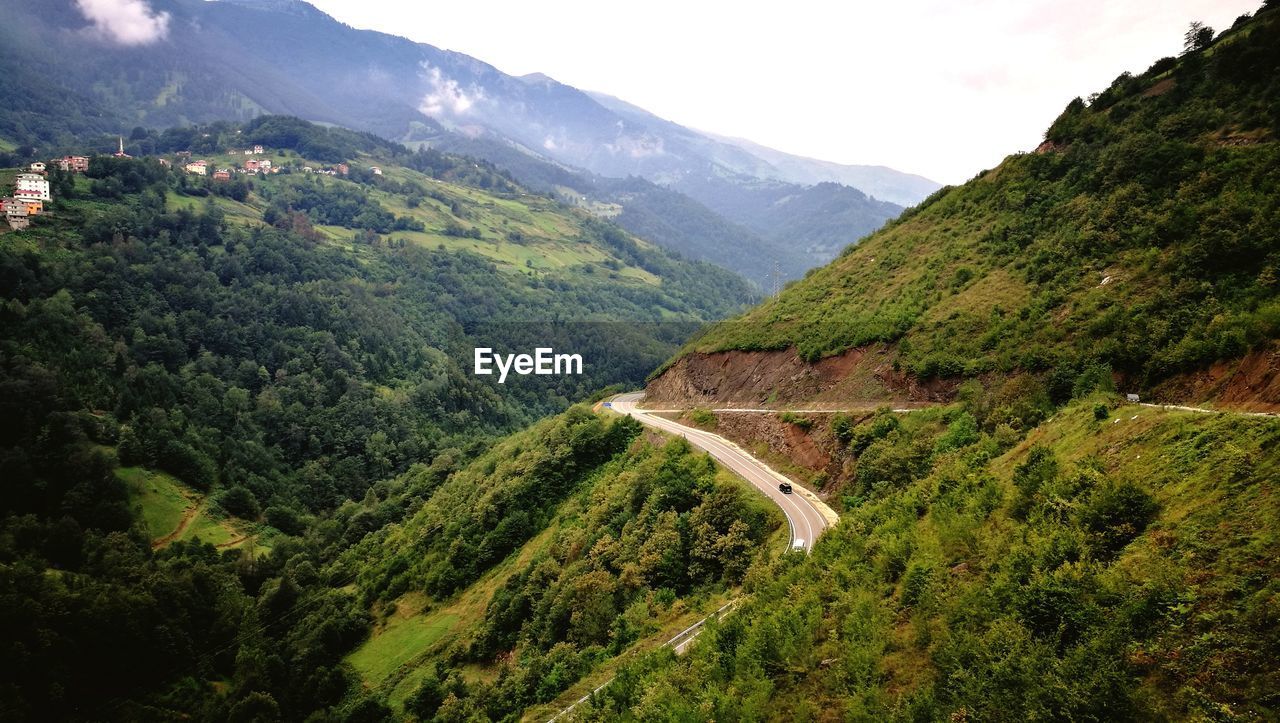 HIGH ANGLE VIEW OF MOUNTAIN ROAD