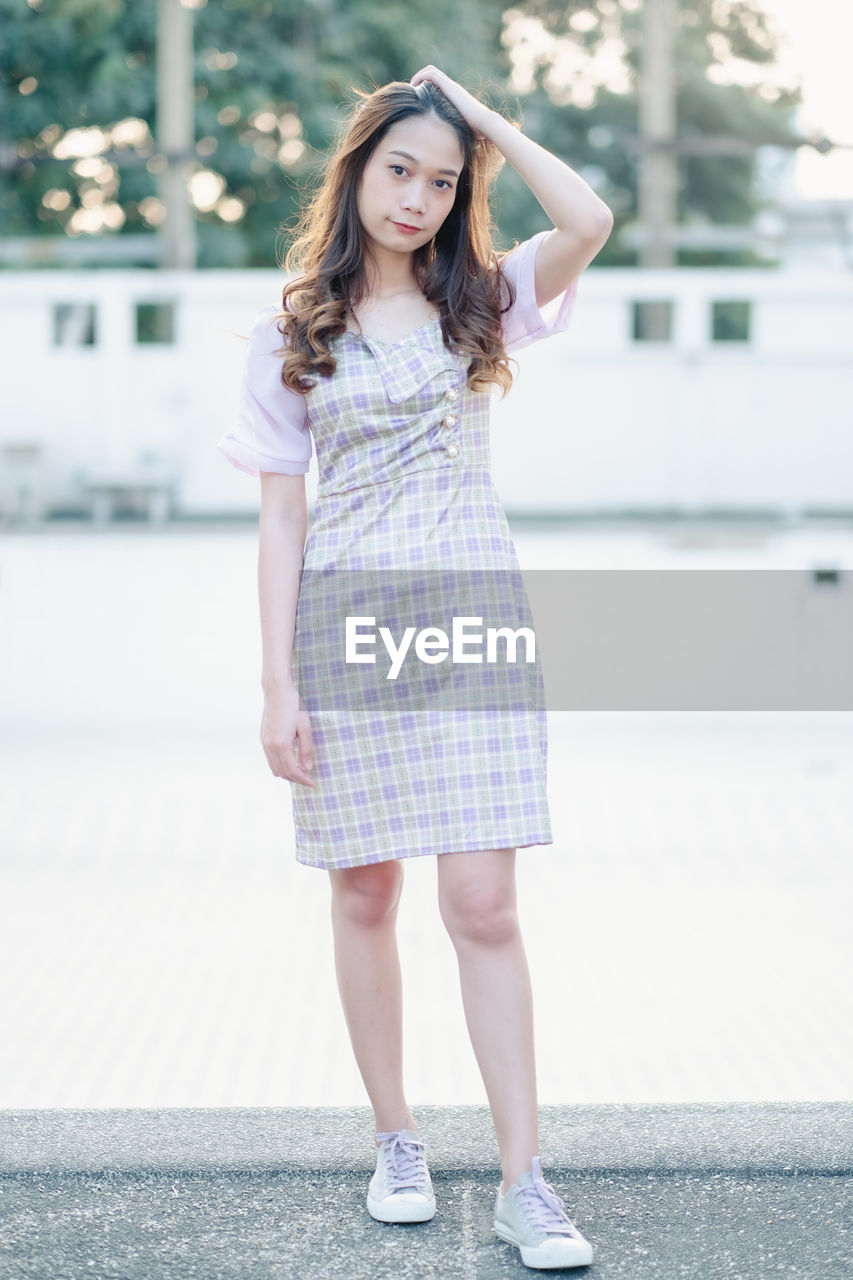 Portrait of teenage girl standing outdoors