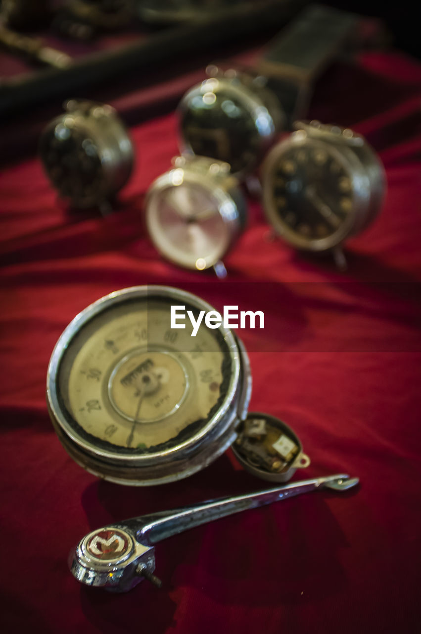 CLOSE-UP OF RED OBJECT ON TABLE