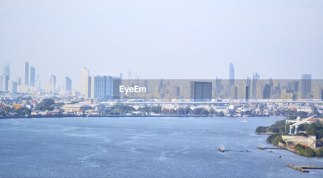 Modern buildings in city against clear sky