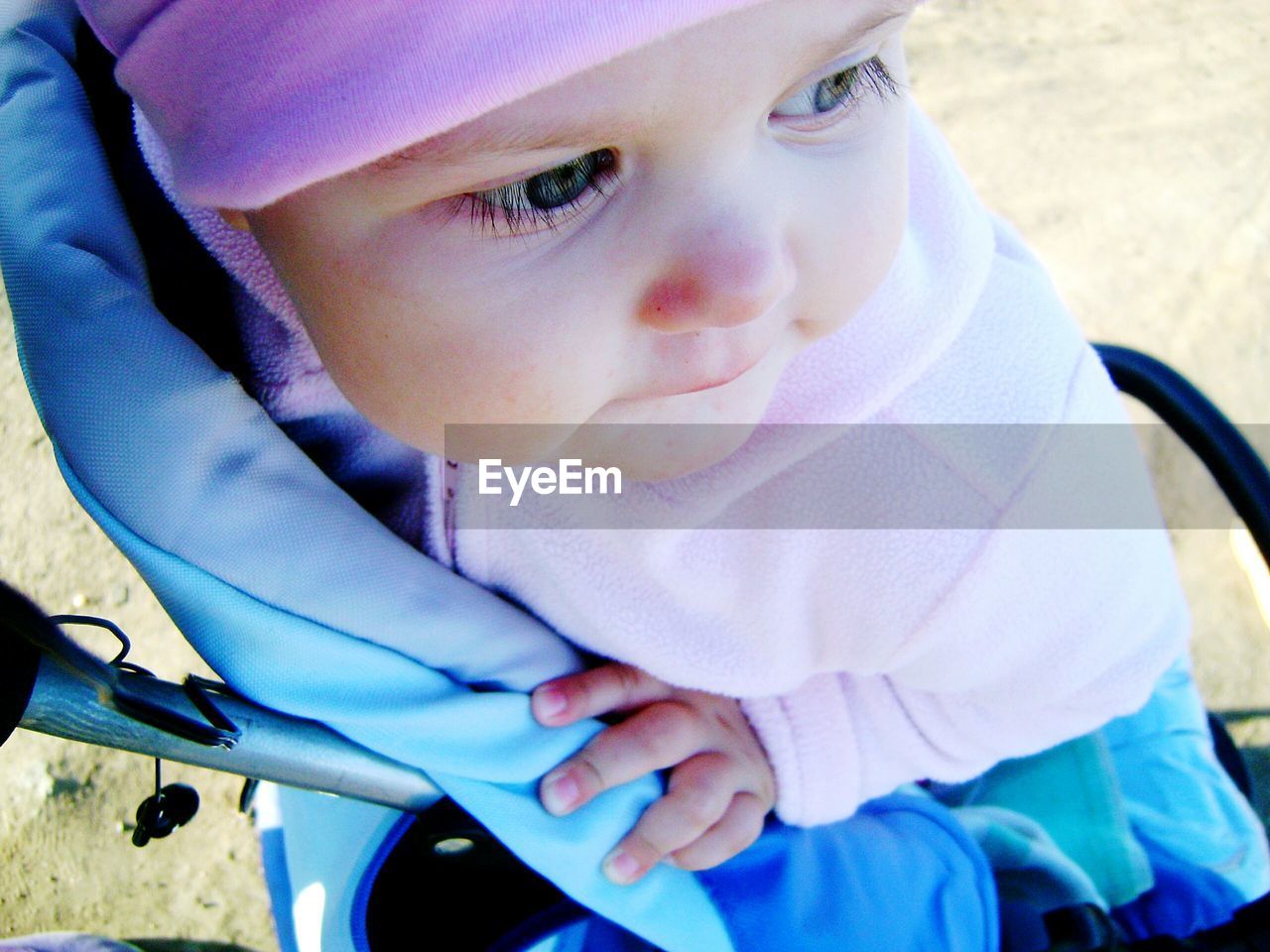 Close-up of cute baby in stroller