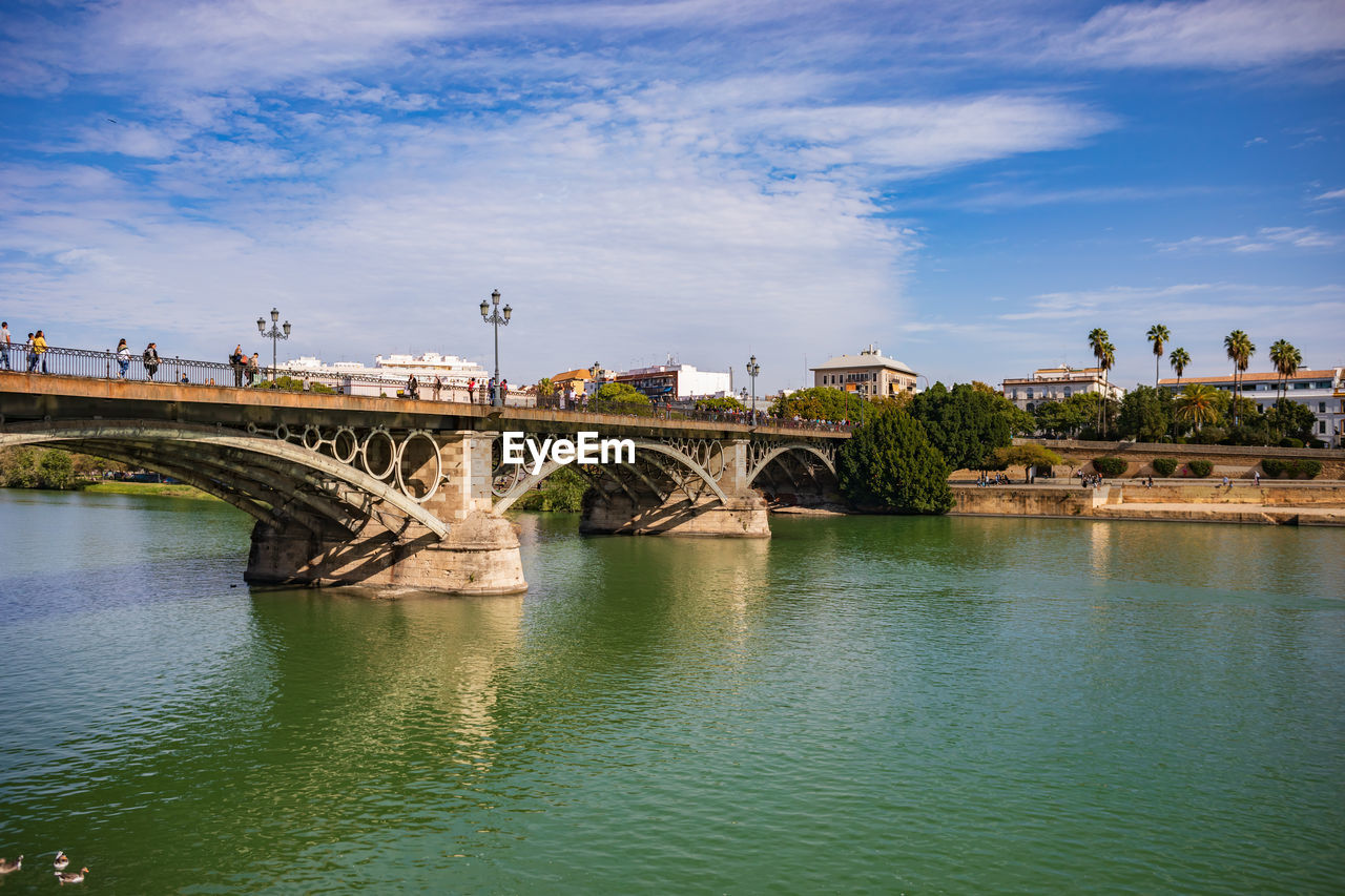 ARCH BRIDGE OVER RIVER AGAINST SKY