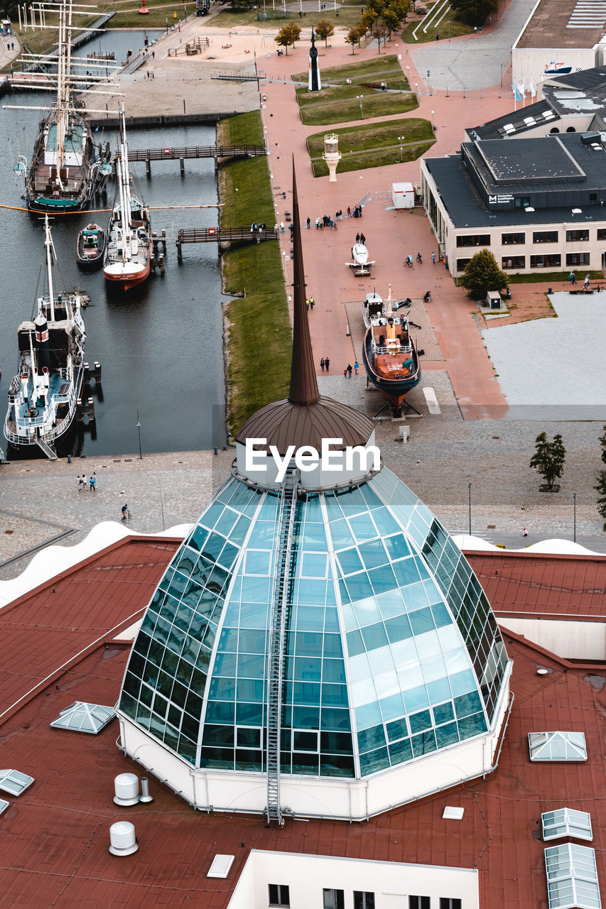 HIGH ANGLE VIEW OF SAILBOATS MOORED ON HARBOR