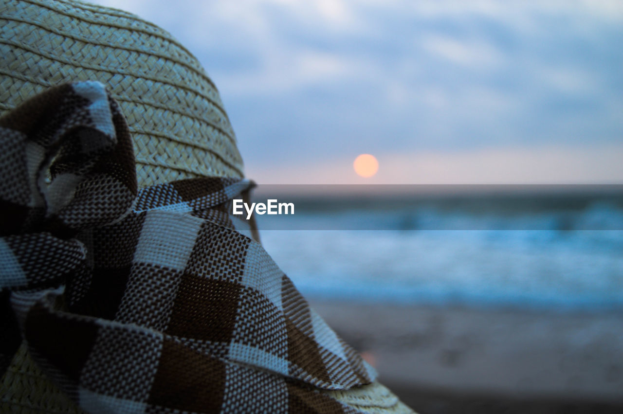 Close-up of sea shore during sunset