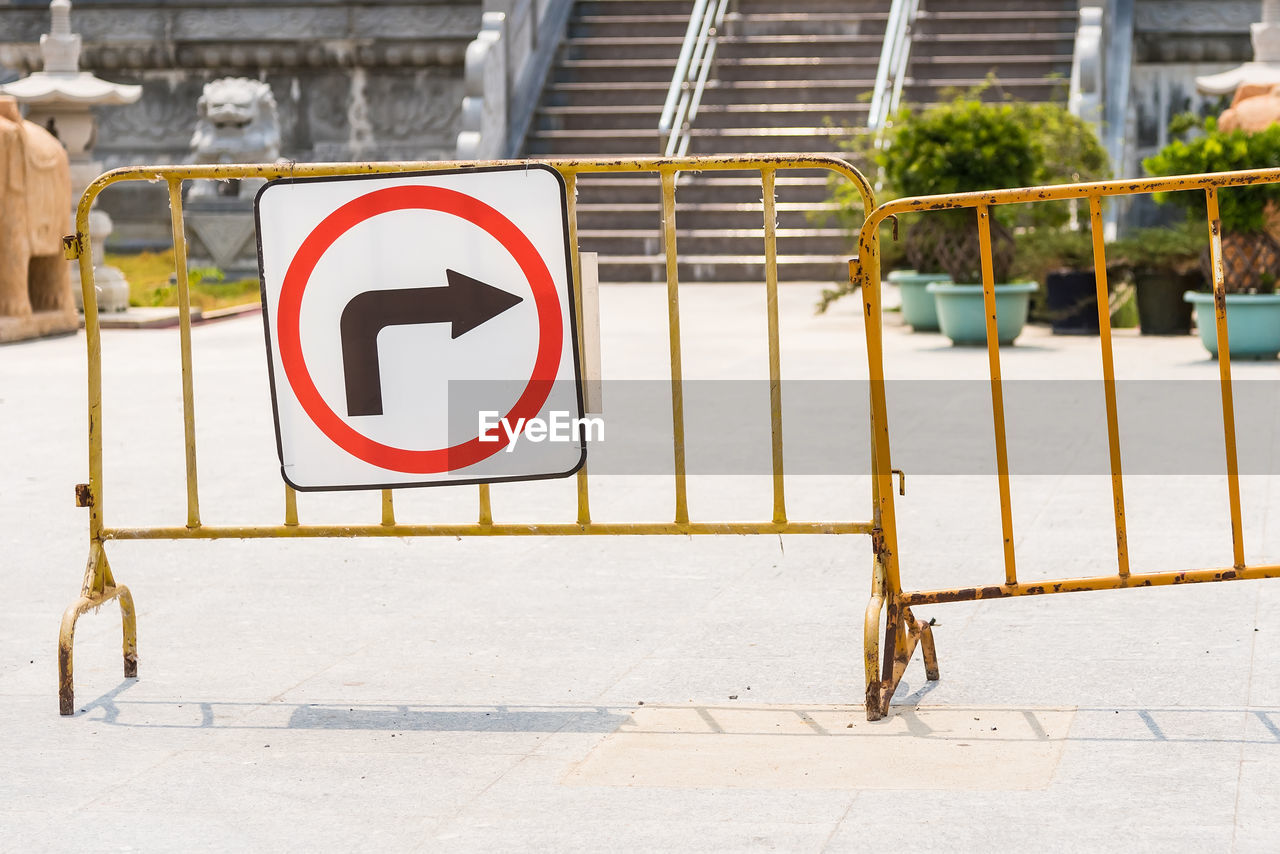 ROAD SIGN ON FOOTPATH BY STREET