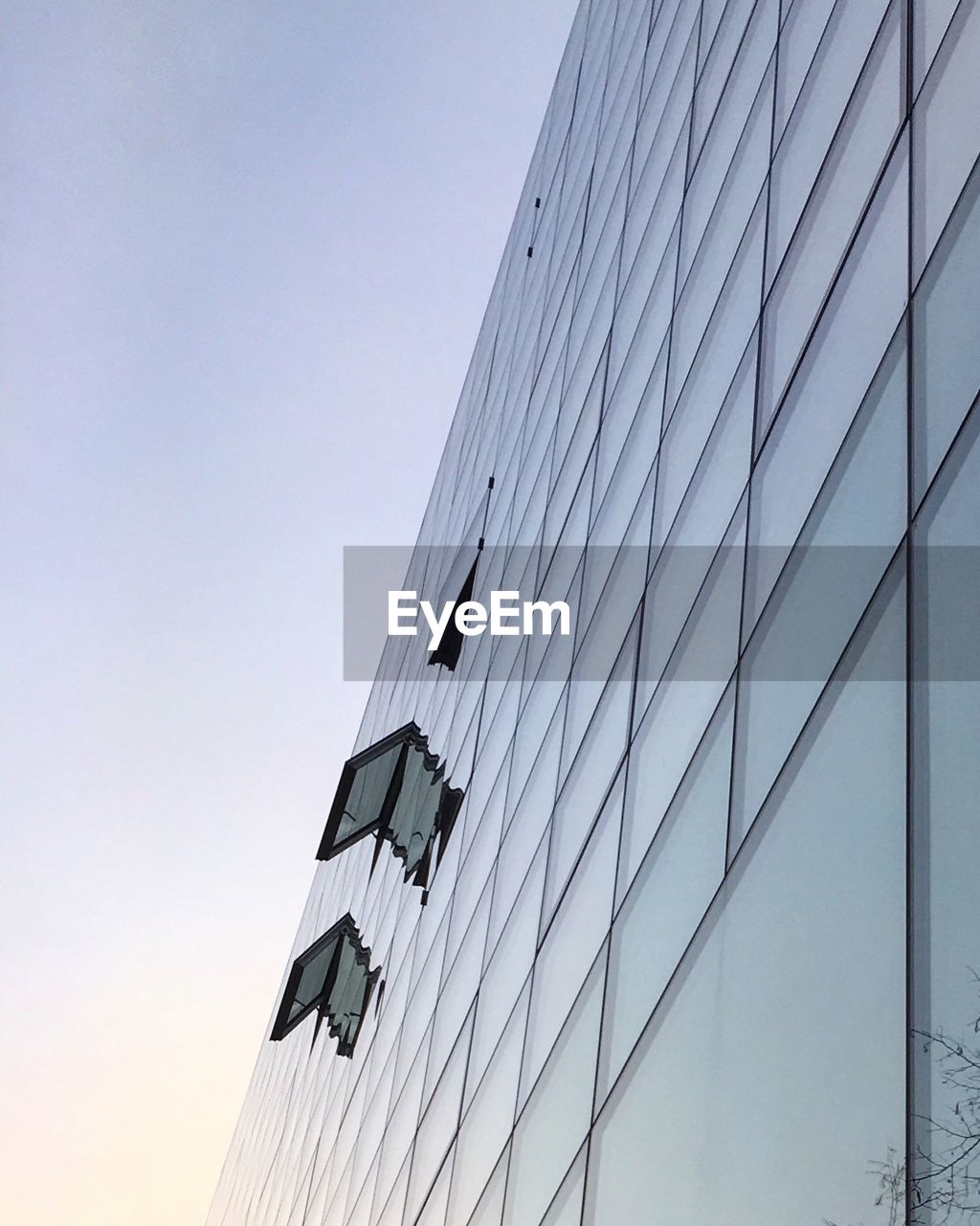 Low angle view of modern building against clear sky