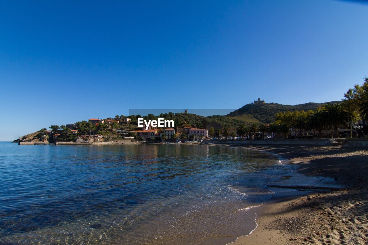 VIEW OF CALM SEA AGAINST CLEAR BLUE SKY