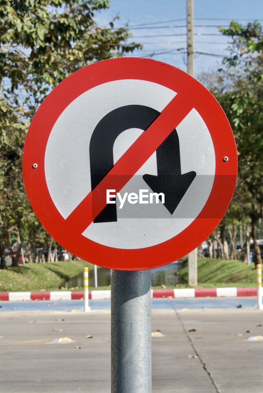 Close-up of road sign on street