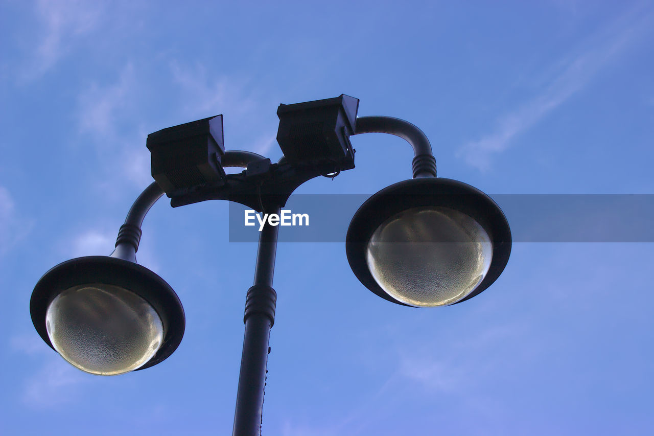 Low angle view of street light against sky