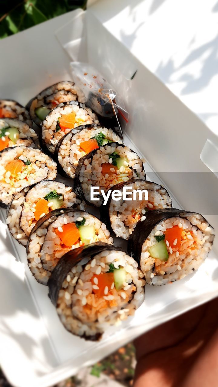 CLOSE-UP OF SUSHI SERVED ON TABLE