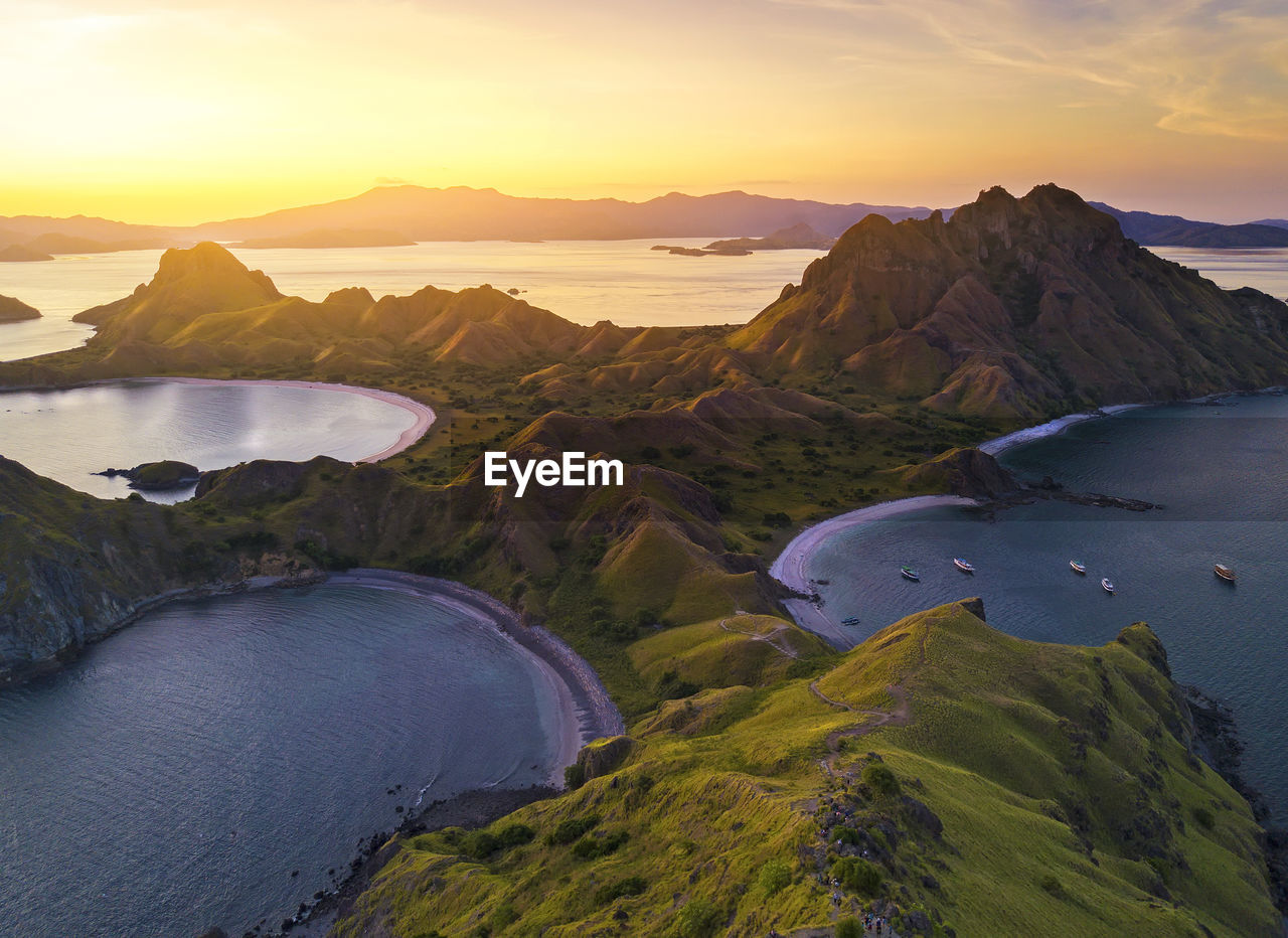 Scenic view of flores island against sky during sunset