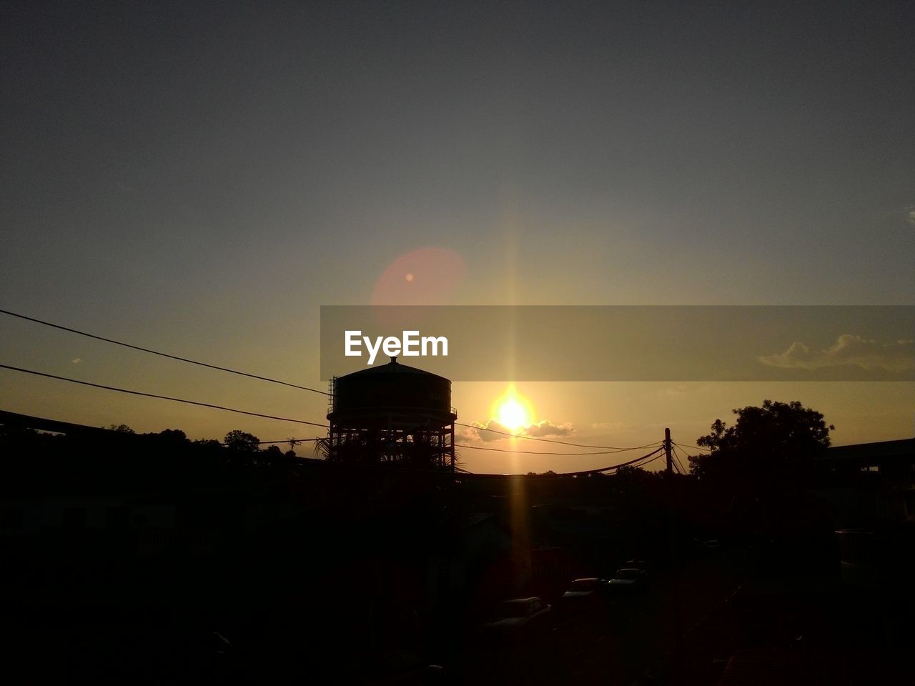 View of cars moving on road at dusk