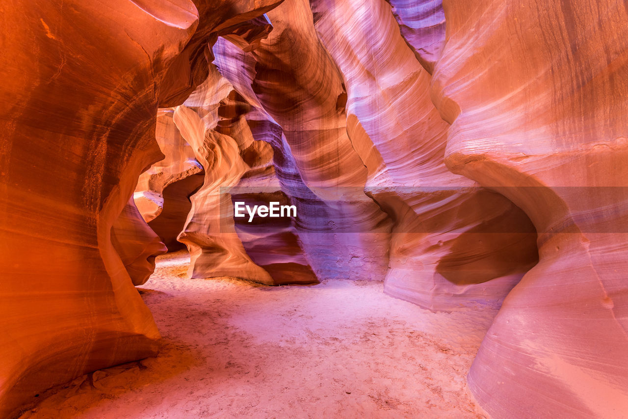 LOW ANGLE VIEW OF ROCK FORMATIONS AT CAVE