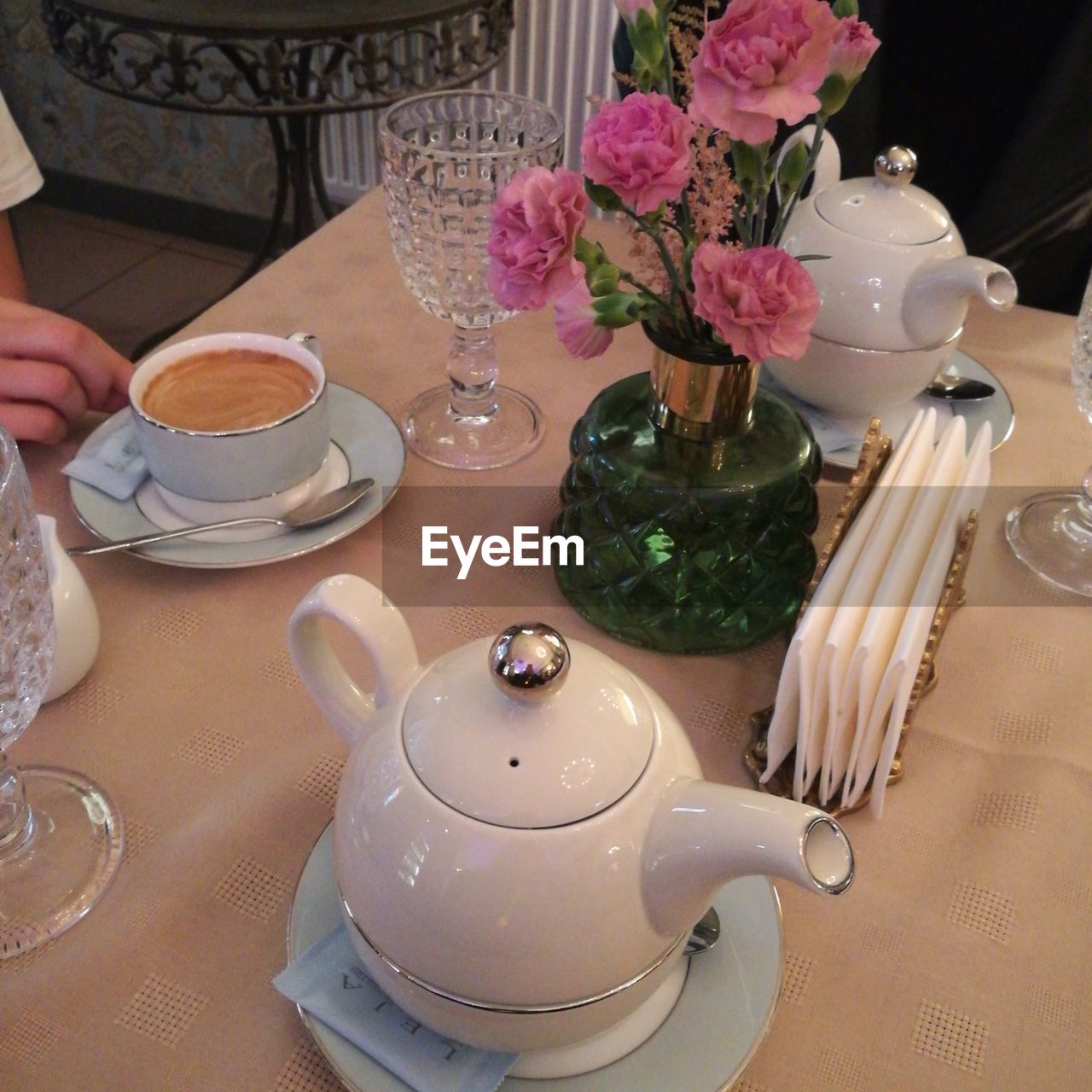 VIEW OF TEA CUP ON TABLE