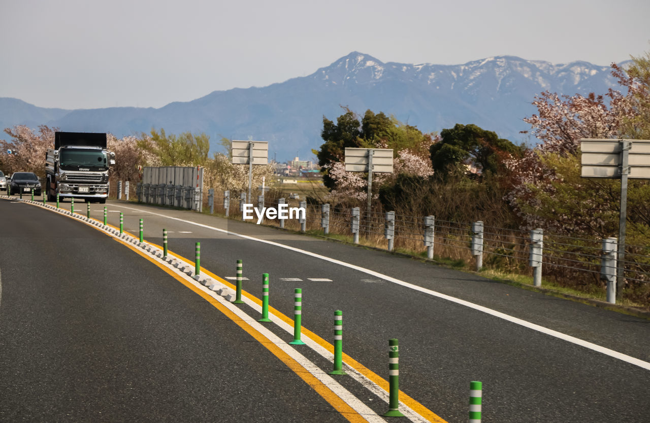 Road in city against clear sky