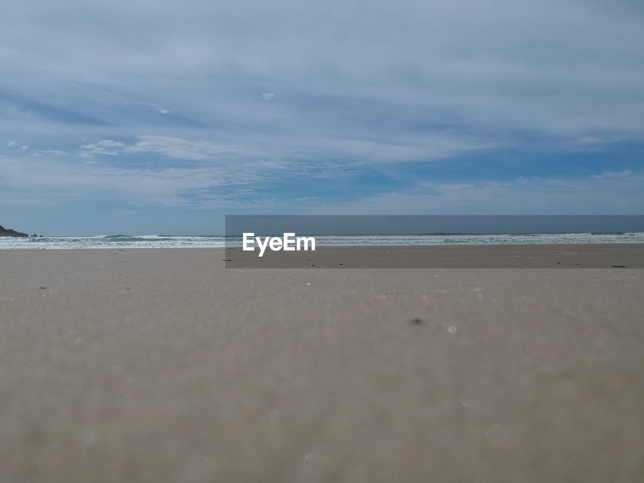 VIEW OF BEACH AGAINST SKY