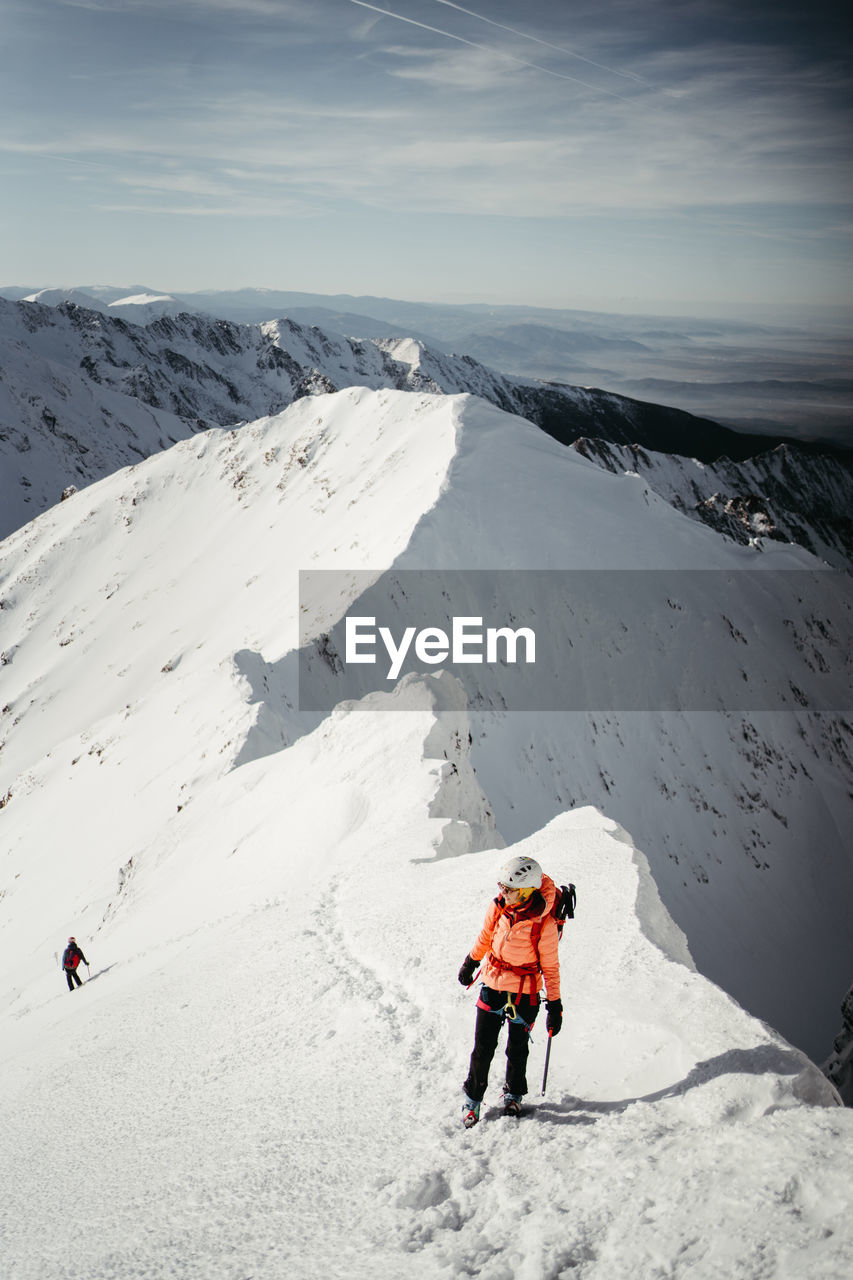 people skiing on snow covered mountain