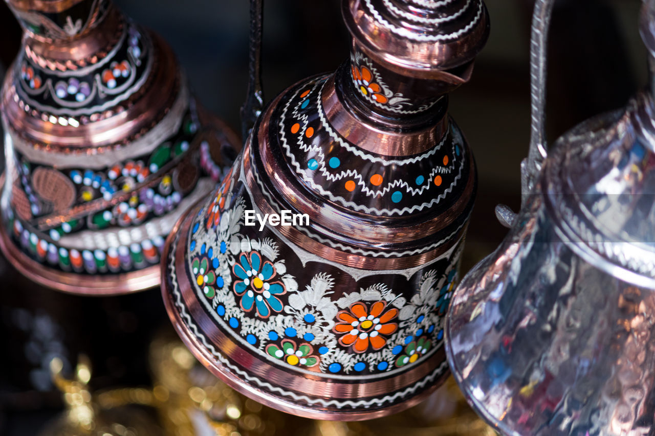 Close-up of bells for sale in market