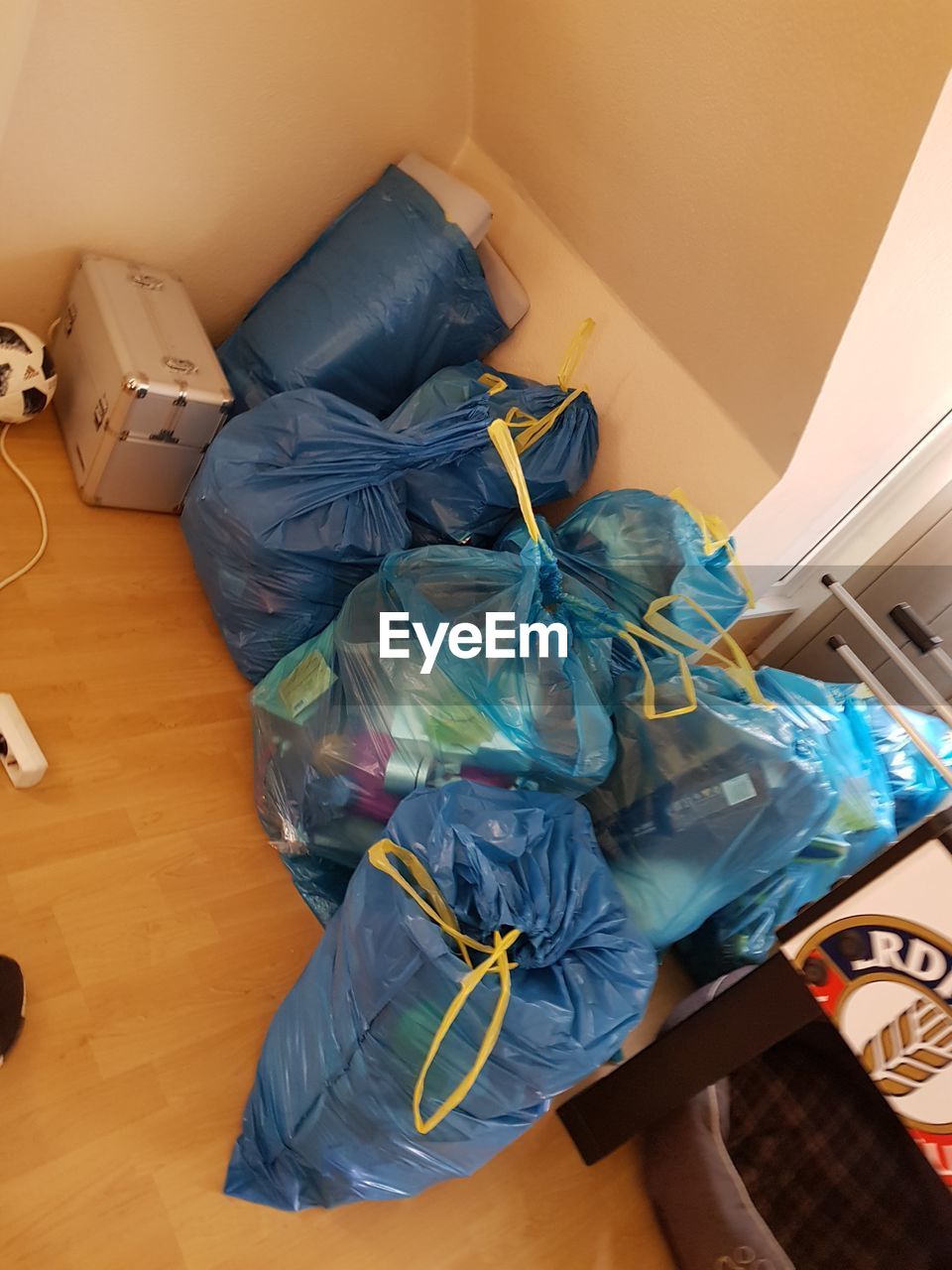 HIGH ANGLE VIEW OF PERSON RELAXING ON FLOOR AT HOME