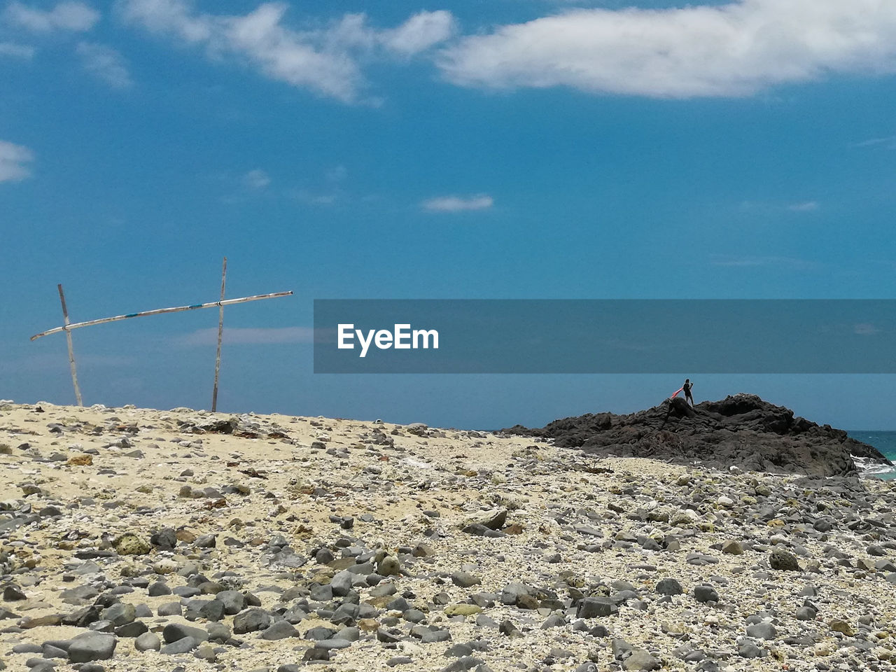 LOW ANGLE VIEW OF WIND TURBINES ON LAND AGAINST SKY