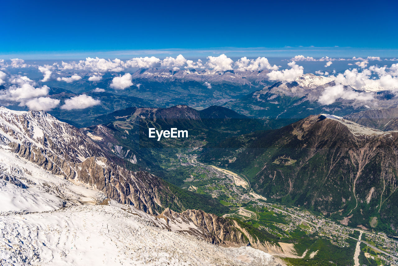 SCENIC VIEW OF DRAMATIC LANDSCAPE AGAINST BLUE SKY