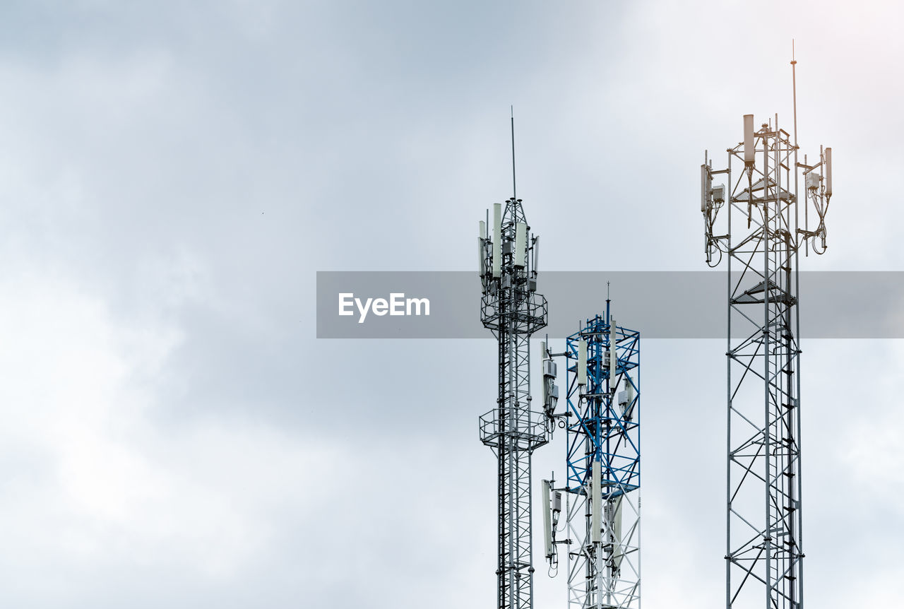 Telecommunication tower with gray sky. antenna. radio and satellite pole. communication technology. 