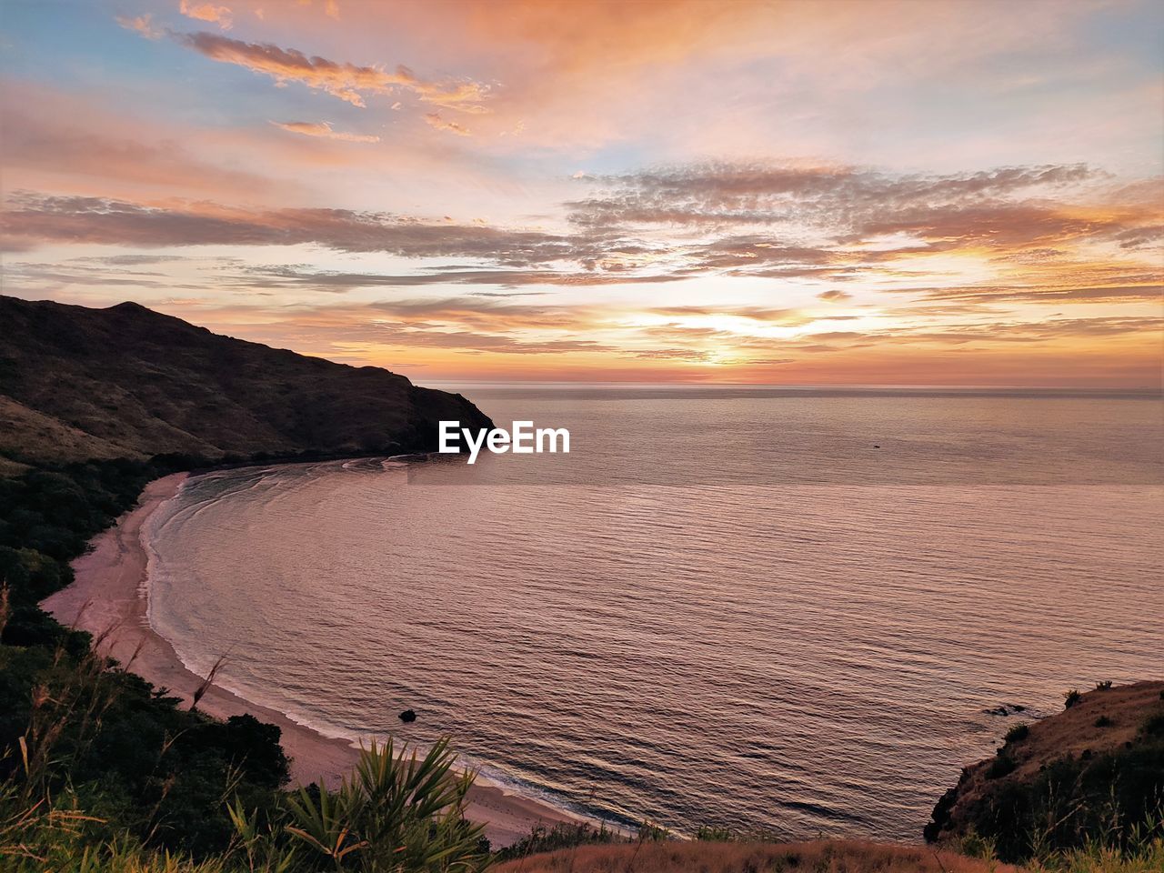 sky, water, sunset, sea, land, scenics - nature, cloud, environment, coast, beauty in nature, landscape, nature, beach, shore, travel, travel destinations, horizon, tranquility, dawn, ocean, no people, dramatic sky, outdoors, seascape, sun, tourism, body of water, coastline, rock, tranquil scene, plant, sunlight, bay, mountain, horizon over water, holiday, evening, trip, cliff, vacation, reflection, summer, cloudscape, non-urban scene, idyllic, twilight, orange color