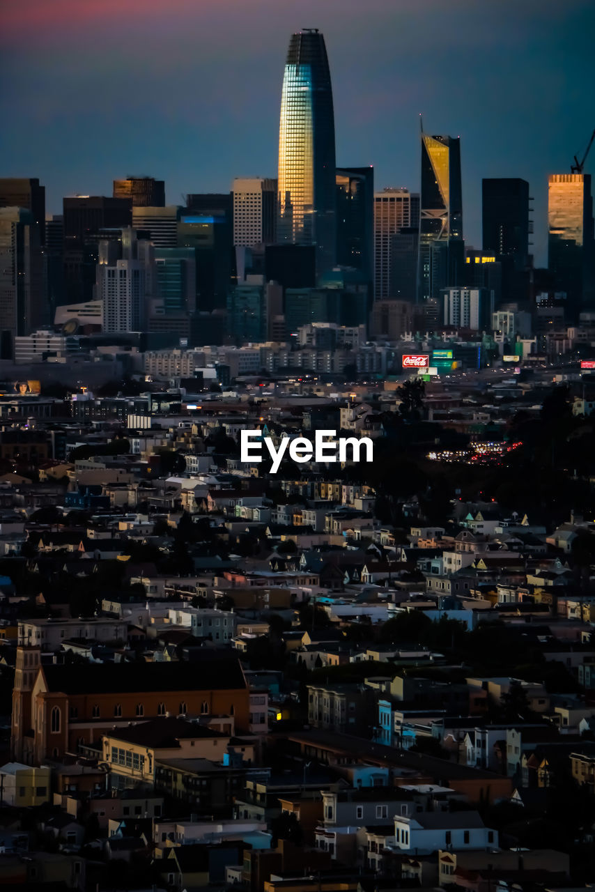 View of illuminated buildings in san francisco against sky