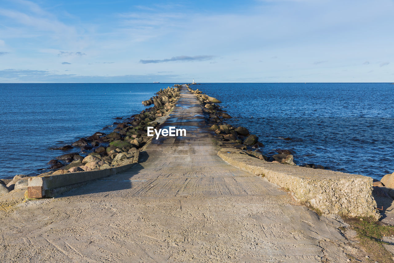 PANORAMIC VIEW OF PIER ON SEA AGAINST SKY