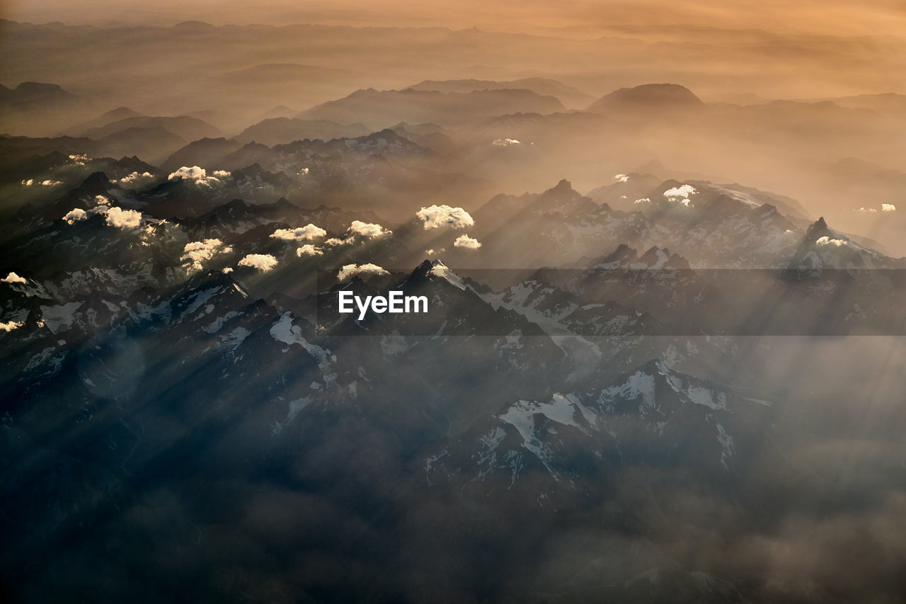 Scenic view of mountains against sky during sunset