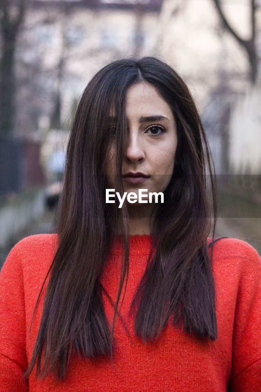 Close-up portrait of beautiful young woman with long hair