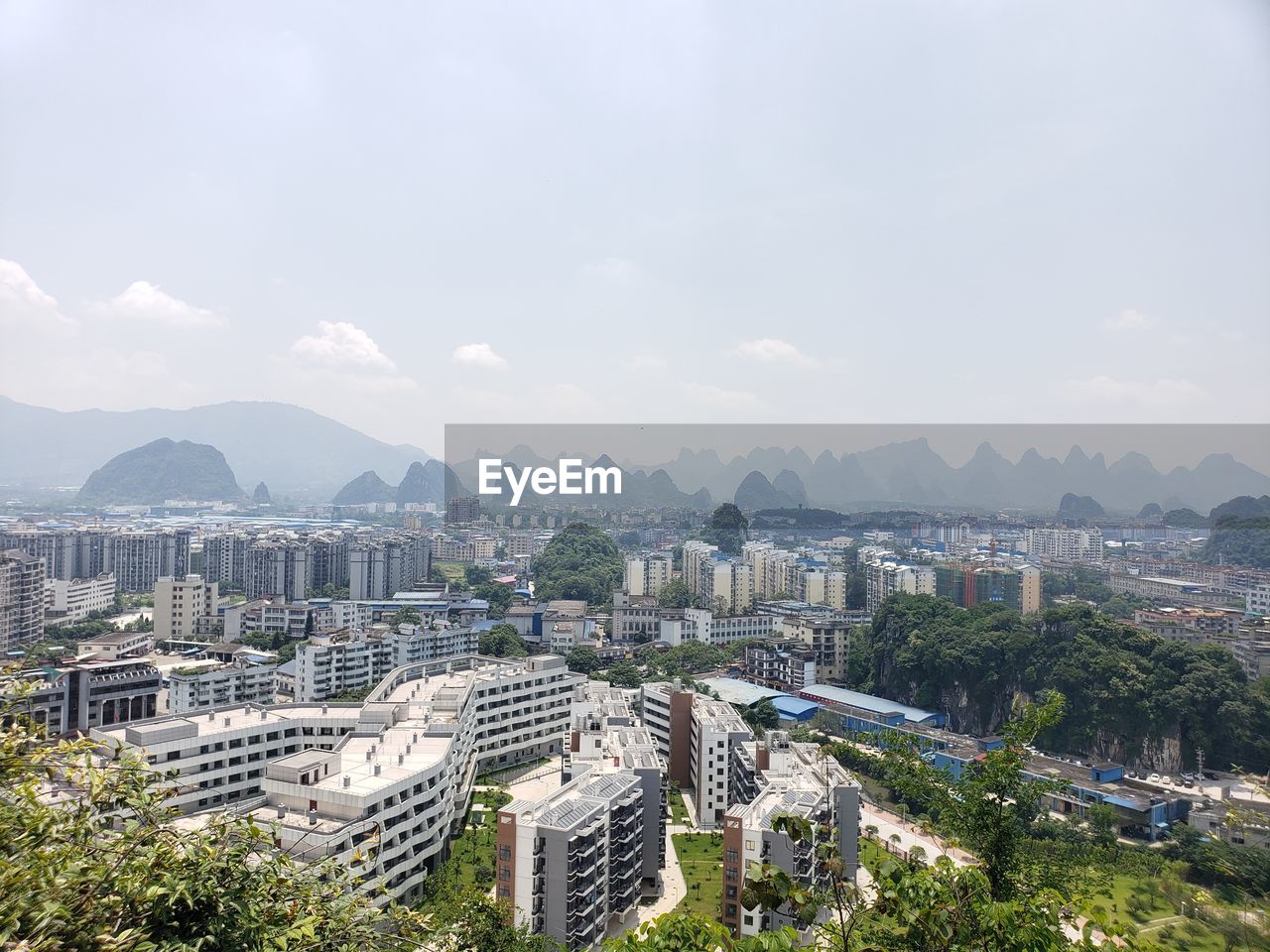 High angle view of buildings in city against sky