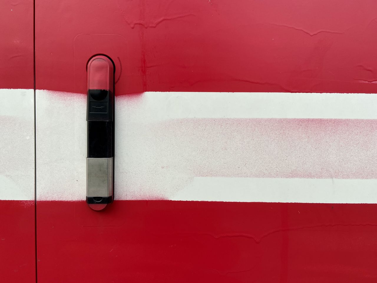 FULL FRAME SHOT OF RED WALL WITH PINK UMBRELLA