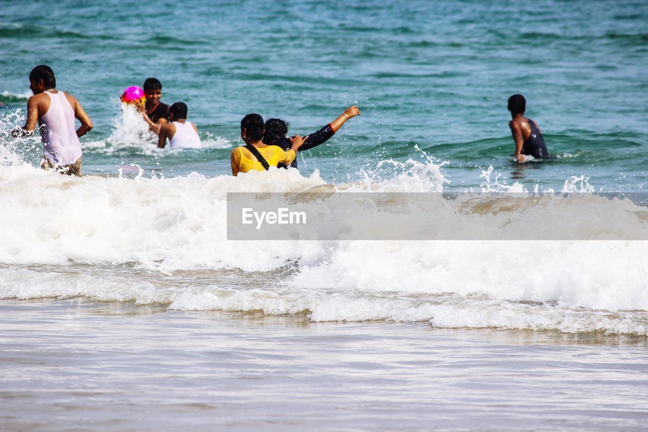 People enjoying at beach