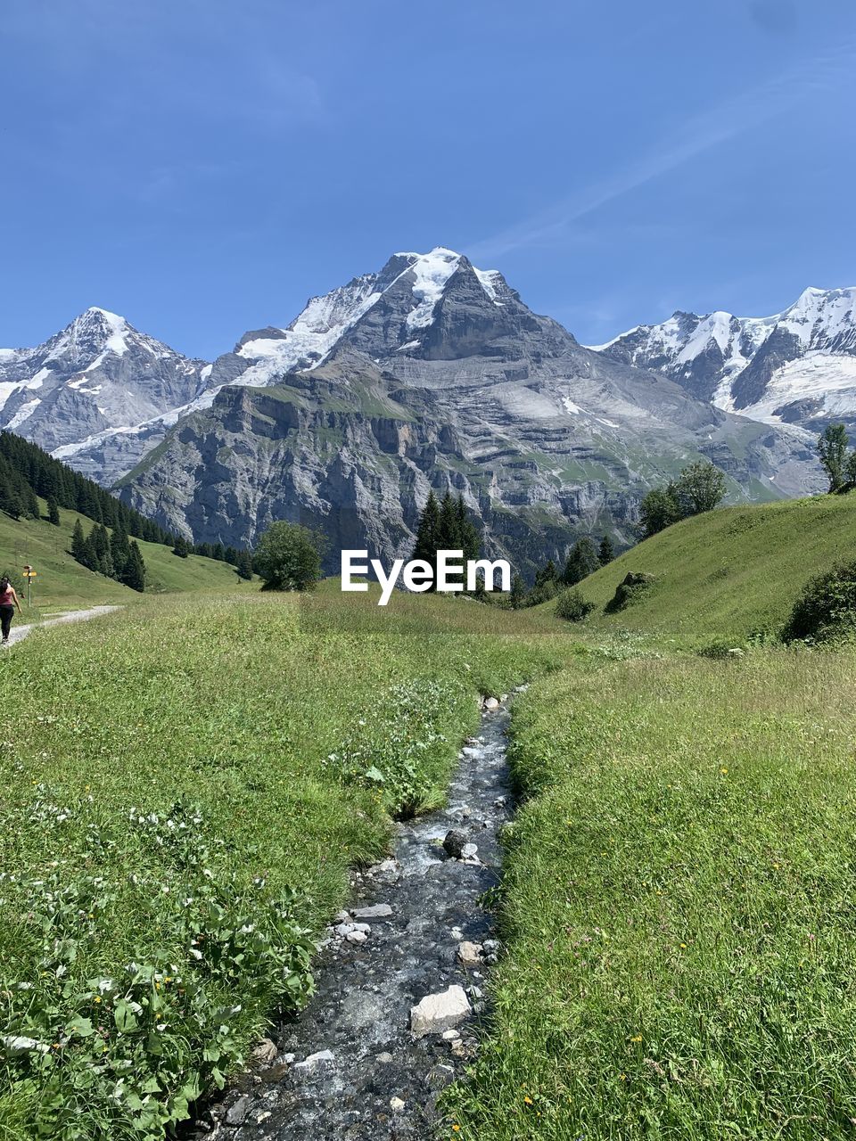 scenic view of landscape against blue sky