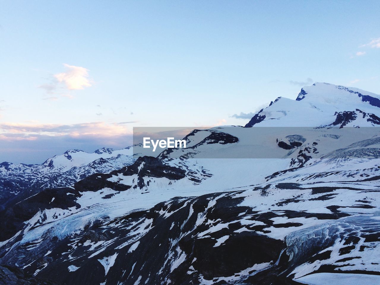 Scenic view of snowcapped mountain against sky