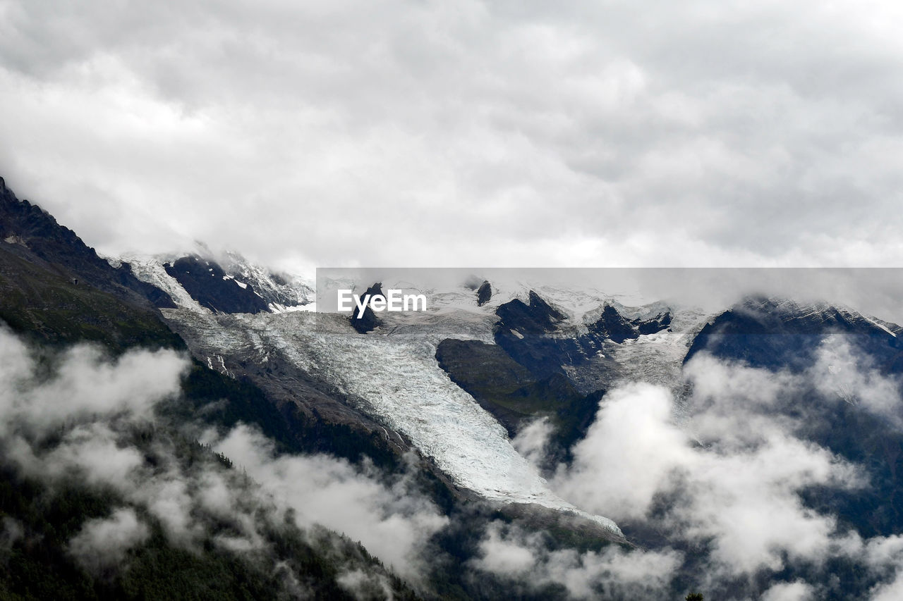 Black and white scenic view of mont blanc mountain against cloudy sky, chamonix, france