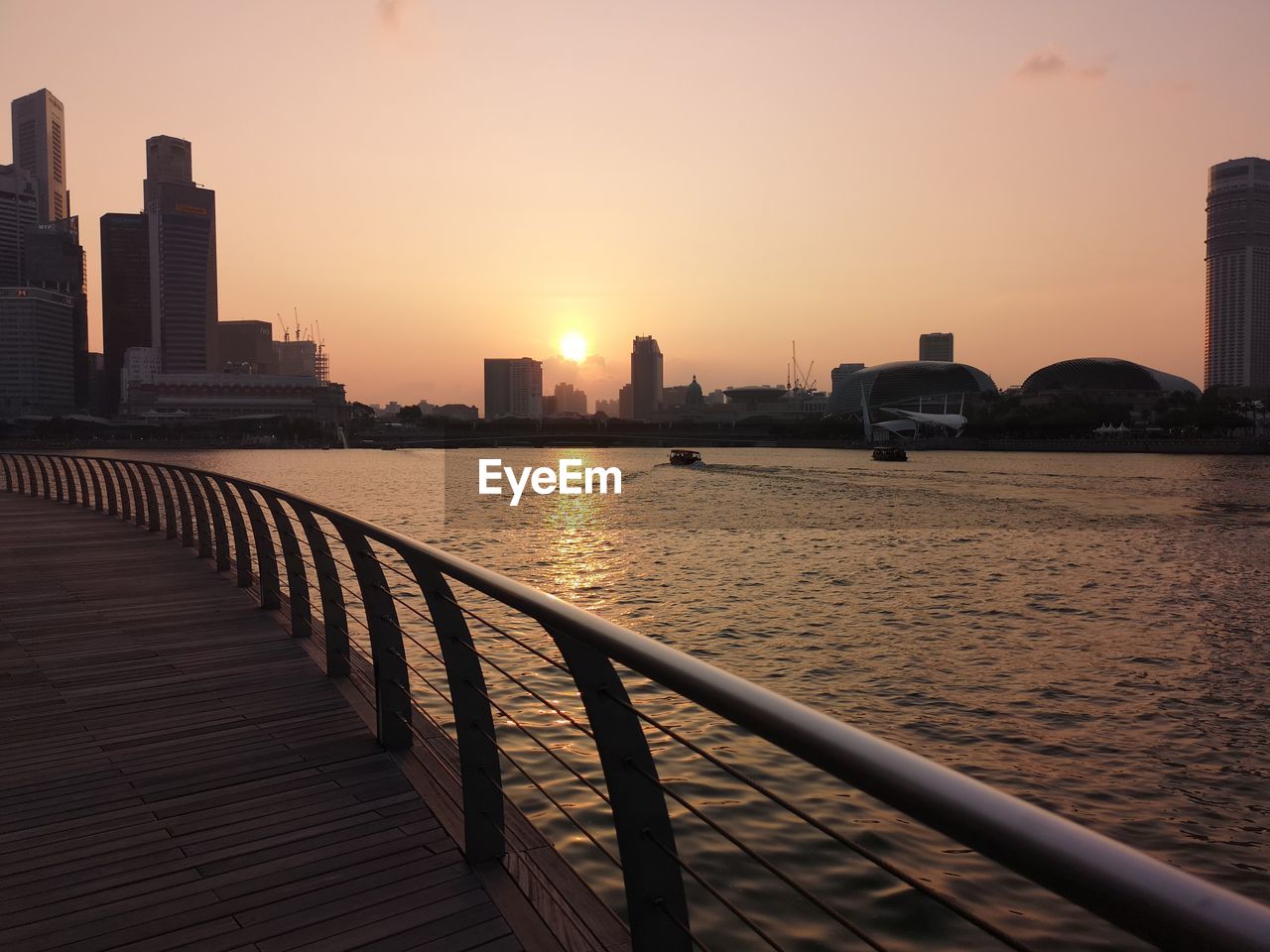 VIEW OF BUILDINGS AGAINST SKY DURING SUNSET