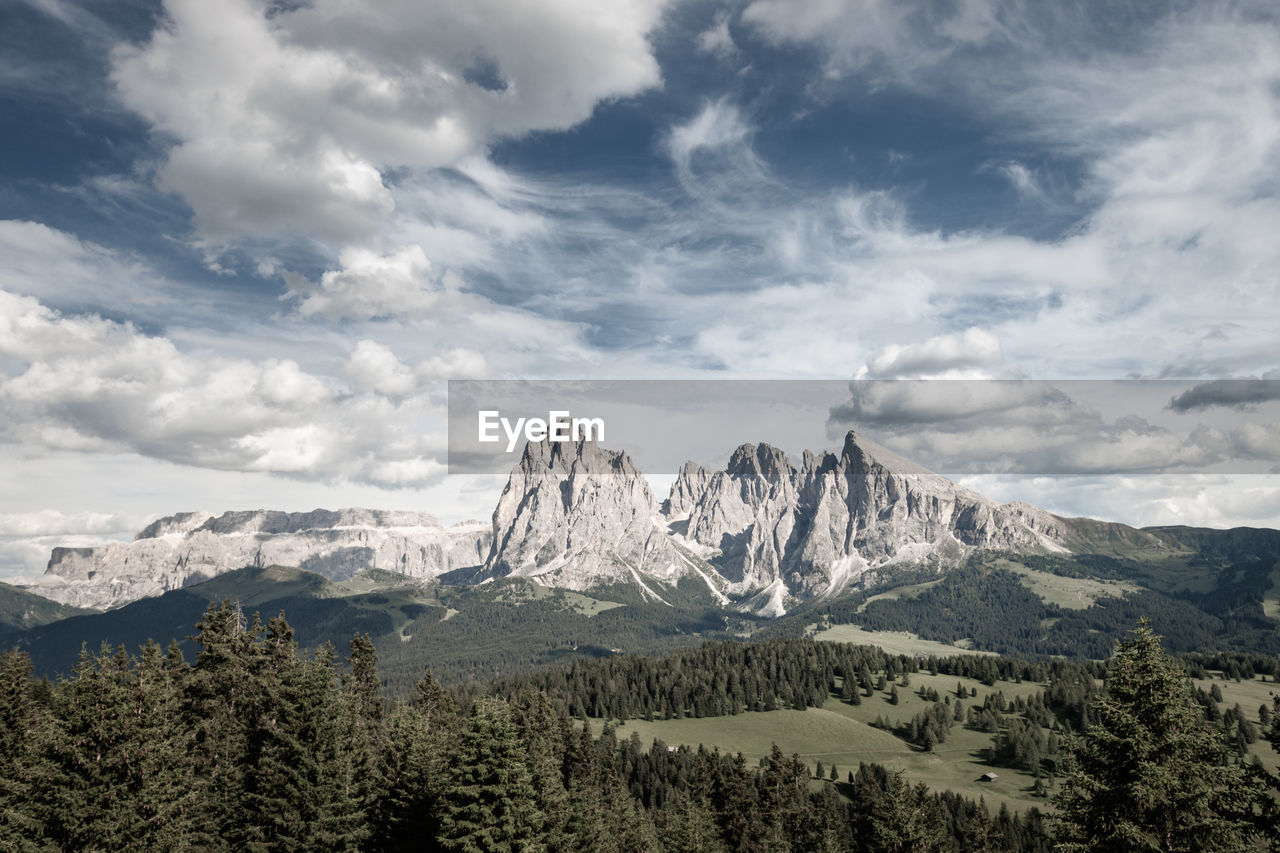 Scenic view of iconic mountains at seiser alm against sky