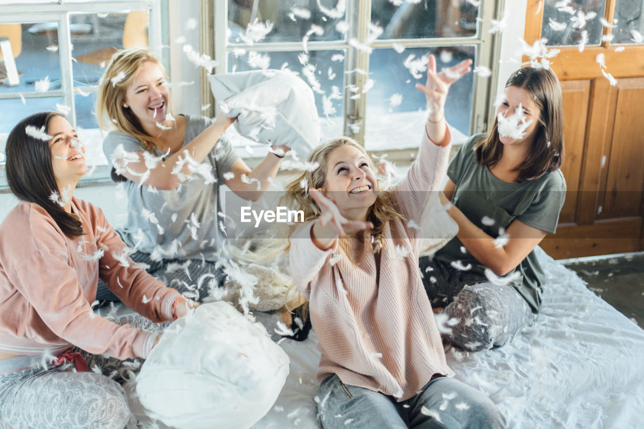 Five girls in a pillow fight