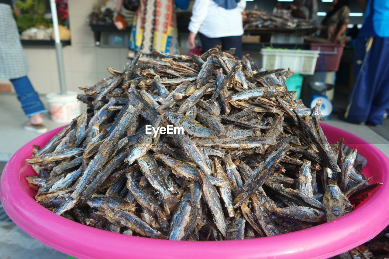 Close-up of salted fish for sale in market