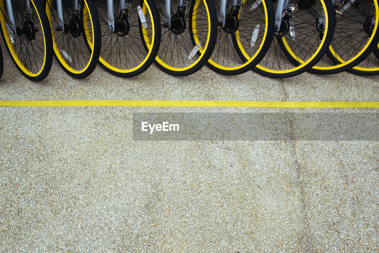 High angle view of bicycles parked on footpath