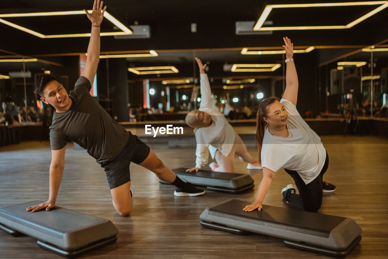 rear view of woman exercising in gym