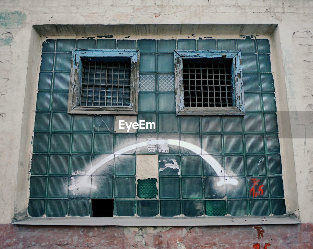 Low angle view of window on building with sad smile 