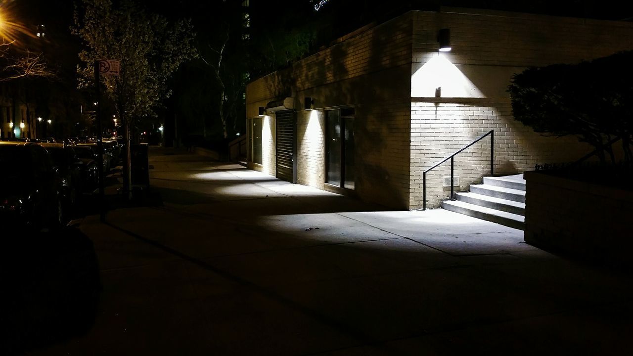 WALKWAY IN ILLUMINATED CORRIDOR