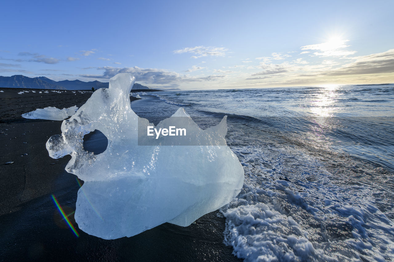 Ice formations on beach during sunrise, vestmannaeyjar, iceland, southern region